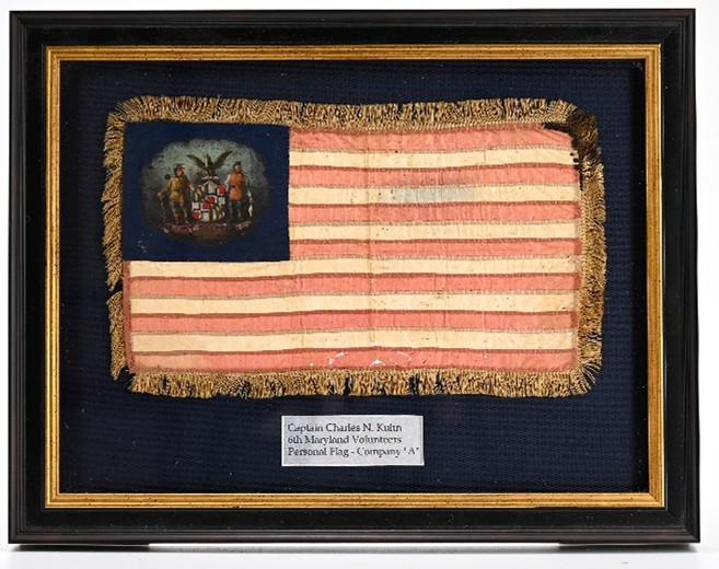 SACK COAT, CAP, SWORD, RUBBER BLANKET, MARYLAND CAMP FLAG AND OTHER EFFECTS OF LIEUTENANT AND CAPTAIN CHARLES N. KUHN, WOUNDED IN ACTION AT CEDAR CREEK WHILE BRIGADE ACTING AIDE-DE-CAMP AT CEDAR CREEK 